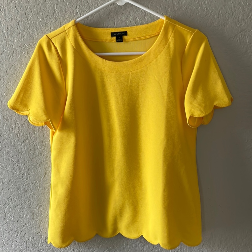 Yellow short sleeve blouse. New without tags. This is Ann taylor brand size XS.